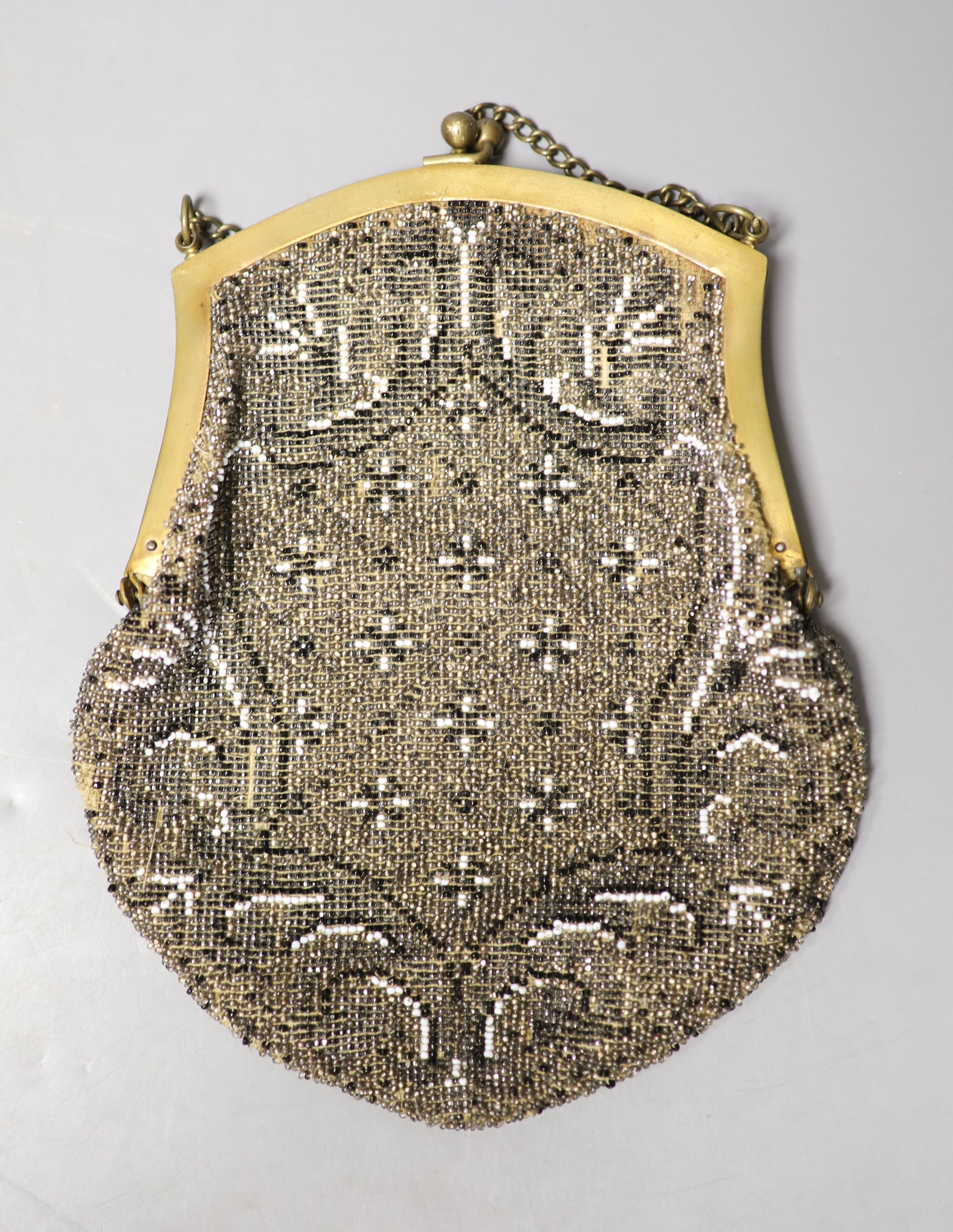 A collection of approximately fifty Victorian and later beadwork, white metal and fabric purses etc.